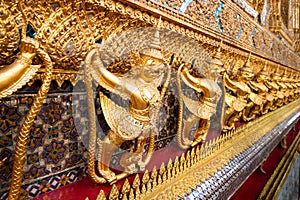 Row of golden garuda scuplture Wat Phra Kaew or the Temple of the Emerald Buddha photo