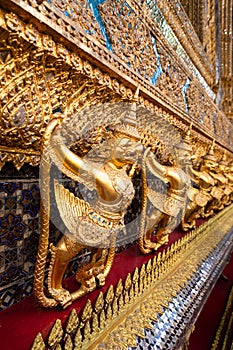 Row of golden garuda scuplture Wat Phra Kaew or the Temple of the Emerald Buddha