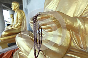 Row of golden seated buddhas