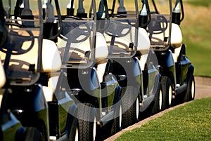 Row of golf carts from front view