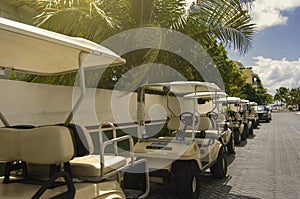 Row of Golf Carts Parked on a Tropical Island