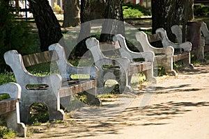 Row of gray stone benches