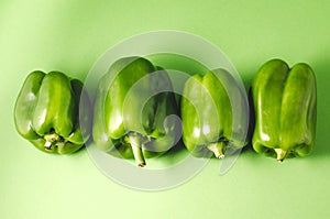 row green paprika pepper close-up/row green paprika pepper over