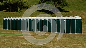 Row of green portable toilets