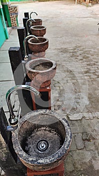 a row of handwashing stations in an elementary school