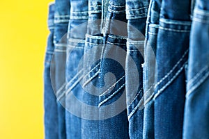 Row of hanged blue jeans