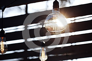 Row of hanging summer terrace lights, small outdoor light bulbs