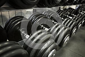 Row of heavy dumbbells in the gym. Active lifestyle and sports