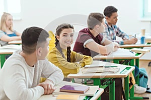 row of high school students sitting in class