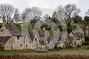 Row of the historic quintessential Cotswold cottages in Bibury, Gloucestershire, England