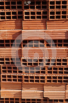 A row of hollow clay bricks background