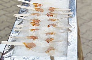 Hot maple syrup on a stick in the snow