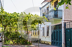 Row house in Gori Georgia where Stalin was born with Soviet era gas pipes used to grow grapes in front garden