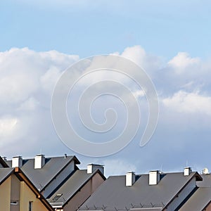 Row house roofs, large detailed panoramic roofscape, condo rowhouse rooftop detail panorama, multiple condos, bright blue summer