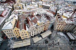 Row houses with traditional red roofs in Prague Old Town Square in the Czech Republic