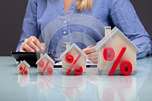 Row Of Increasing House Models On Desk