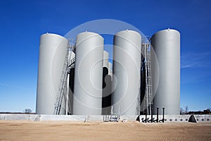 Row of industrial storage tanks