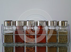 Jars of Herbs and Spices in Spice Rack