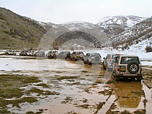 Row of jeeps in mountain