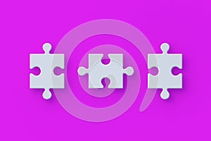 Row of jigsaw puzzle pieces on pink background