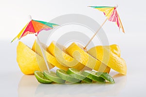 Row of juicy yellow lemon sliced wheels with straw