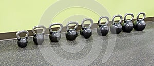 Row of Kettlebells at Fitness Center photo