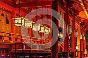 Row of lanterns decorating the Fushimi Inari shrine at night, Kyoto, Japan