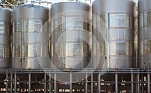 Metal wine storage tanks. Industrial wine cellar.