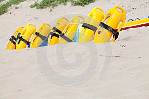 Row of lifesaving floation devices on the beach