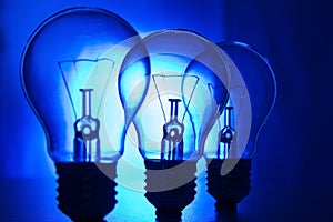 Row of light bulbs on a bright blue background