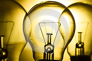 Row of light bulbs on a bright yellow background