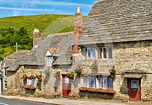 Row of limestone cottages in an English village photo