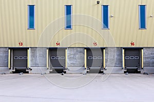 Row of loading docks with shutter doors at an industrial warehouse