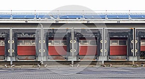 Row of loading docks with shutter doors at an industrial warehouse