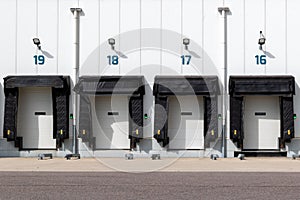 Row of loading docks with shutter doors at an industrial warehouse