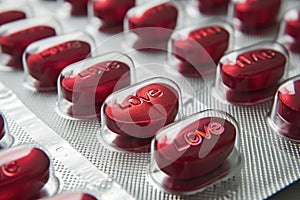 A Row of Love Pills Spelling Love