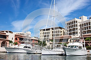 Row of luxury yachts mooring in a harbour