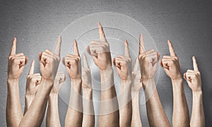 Row of man hands showing finger pointing gesture