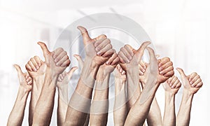 Row of man hands showing thumb up gesture