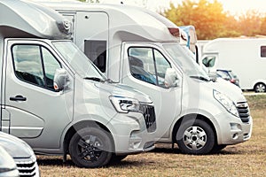 Row of many parked horse box cargo trailer transport and horse transportation rv camper van farm ranch campground horse