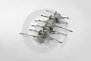 Row of medium power rectifier diodes. Vintage electronic components with long leads for mounting and for combination with other