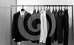 Row of men's suits hanging