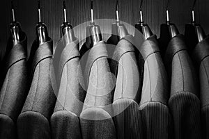 Row of men suit jackets.