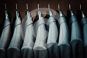 Row of men suit jackets on hangers