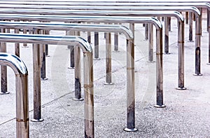 Row of metal hand handrails in the park