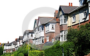 Row of modern houses in street isolated on white