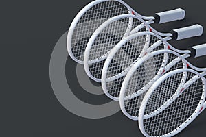 Row of modern tennis racquets. Sports equipments