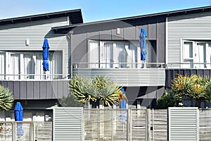 Row of modern townhouses with metal facade