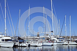 Row of moored sail boats and yachts in a marina in the canary islands