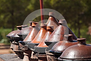 Row of Moroccan clay tagines -  traditional cooking vessels